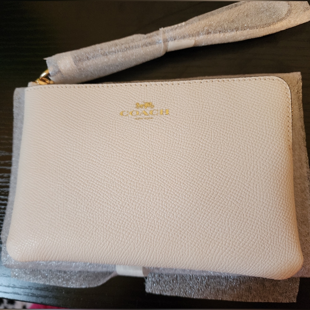 Coach Corner Zip Wristlet in color Chalk White